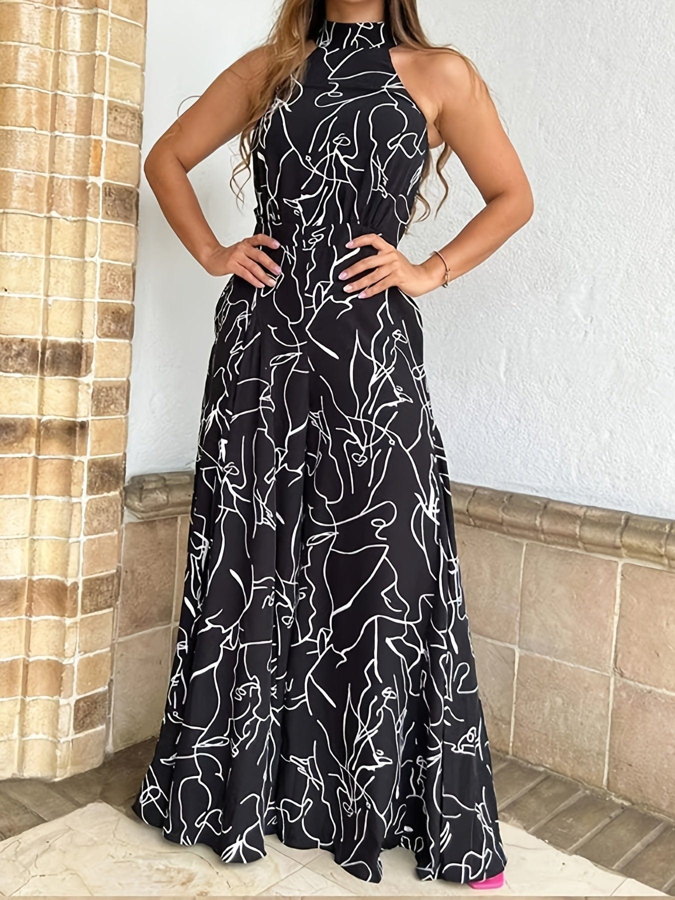 Stylish sleeveless pantsuit with modern print and high waist belt for wide-leg legs, for a fashionable and unique look