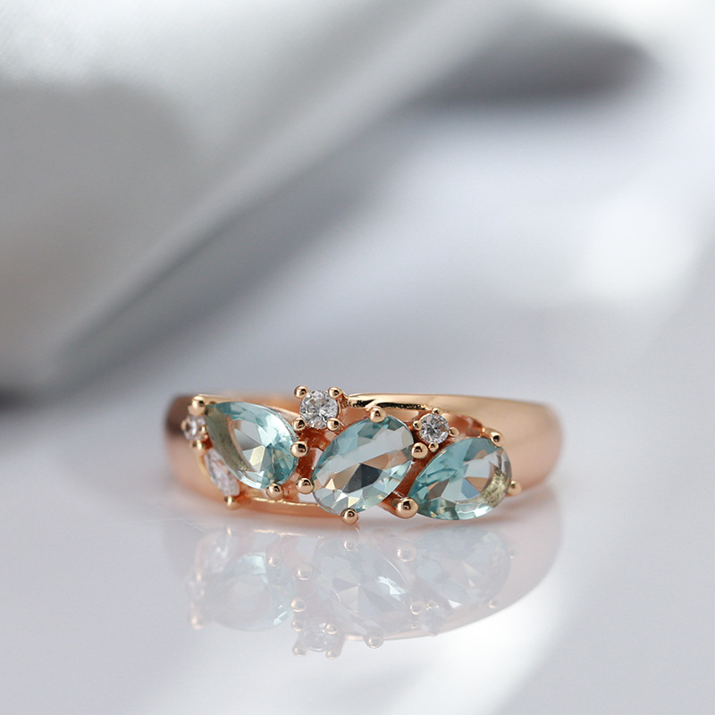 Ring with blue marquee rhinestone in luxurious gold design