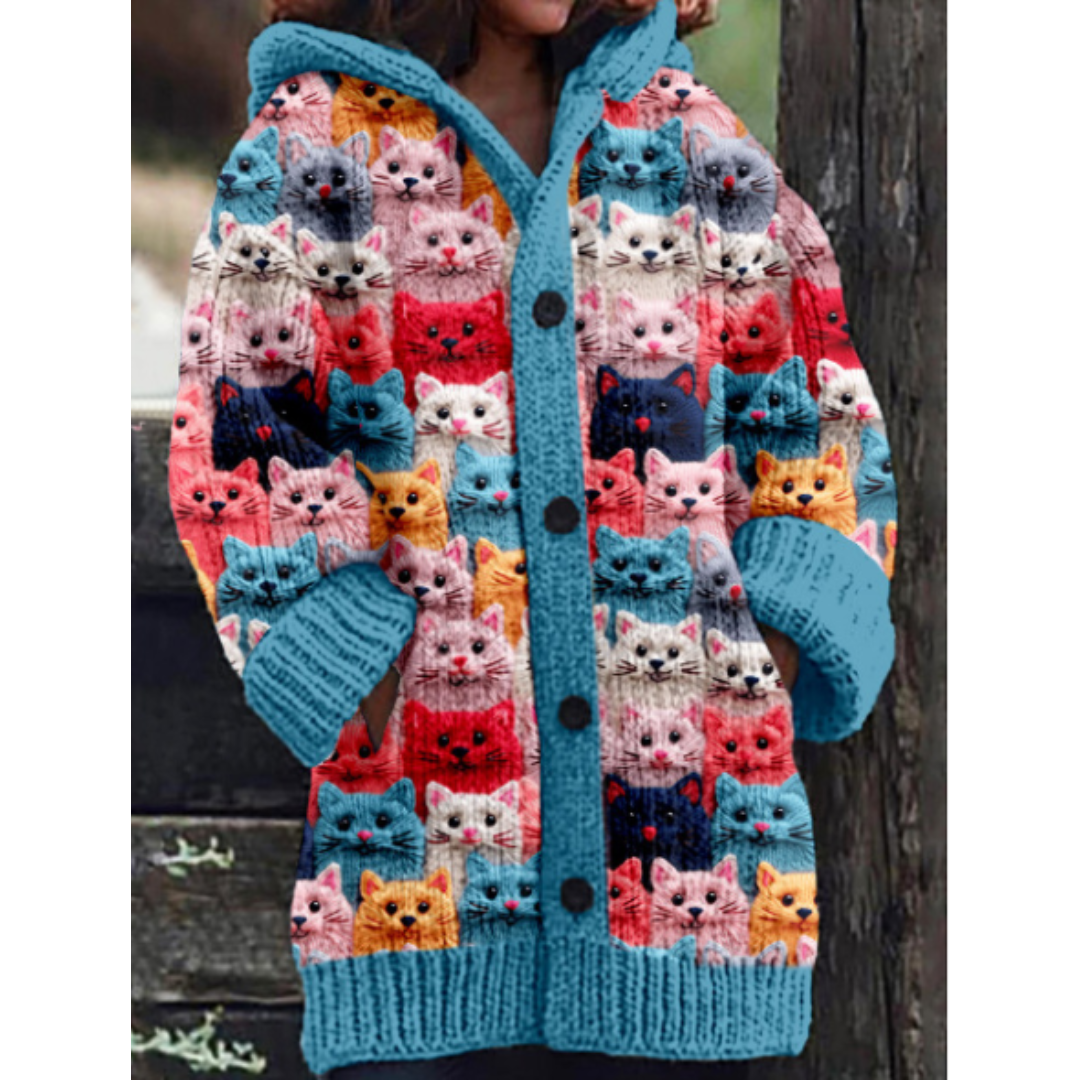 Warm knitted women's jacket with hoodie and cat pattern – stylish design, button closure, and feather insulation for a chilly day
