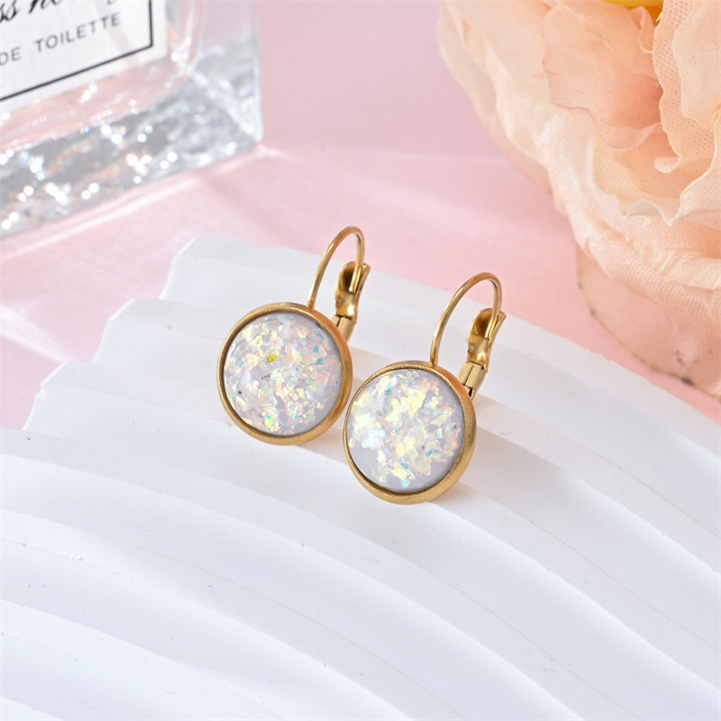 Stunning gold earrings with vintage opal stone by Ulani for a unique style experience
