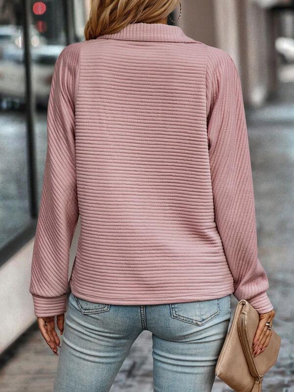 Elegant women's sweater with long sleeves and a stunning V-neckline with partial zipper for a perfect style
