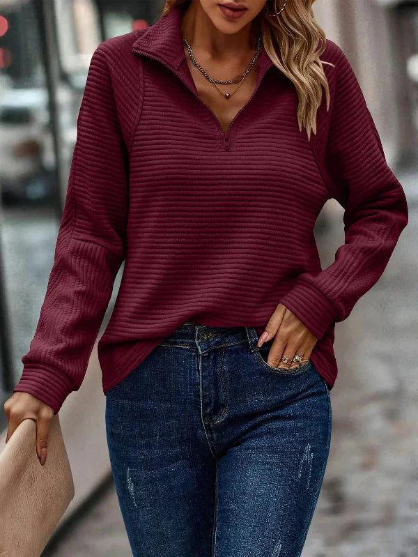 Elegant women's sweater with long sleeves and a stunning V-neckline with partial zipper for a perfect style