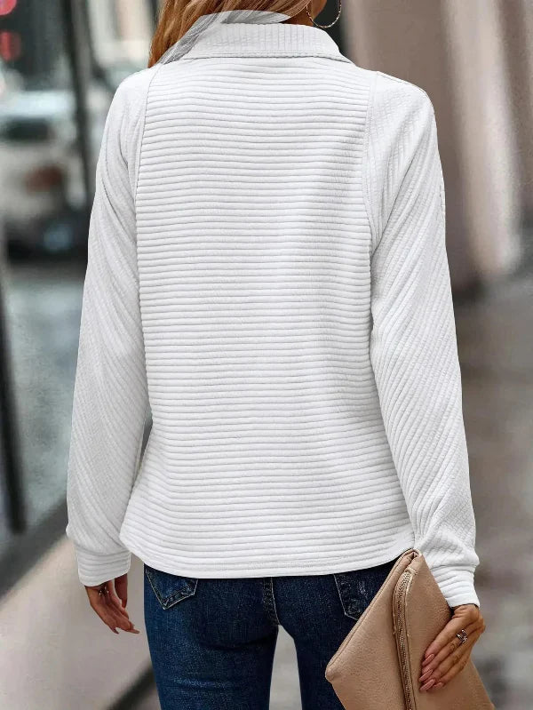 Elegant women's sweater with long sleeves and a stunning V-neckline with partial zipper for a perfect style
