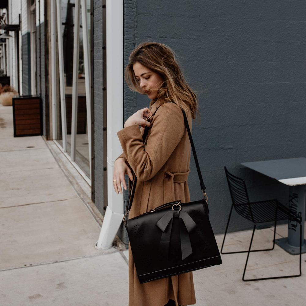 Fashionable bag with a unique and attractive feather ornament by Grace