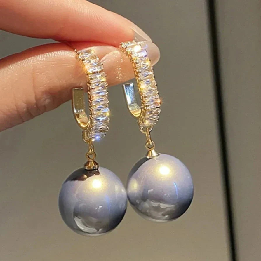 Elegant pearl and zirconia earrings from Elena - a stunning addition to any outfit