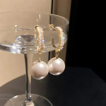 Elegant pearl and zirconia earrings from Elena - a stunning addition to any outfit