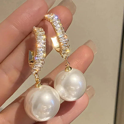 Elegant pearl and zirconia earrings from Elena - a stunning addition to any outfit
