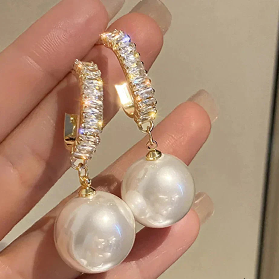 Elegant pearl and zirconia earrings from Elena - a stunning addition to any outfit