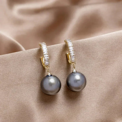 Elegant pearl and zirconia earrings from Elena - a stunning addition to any outfit