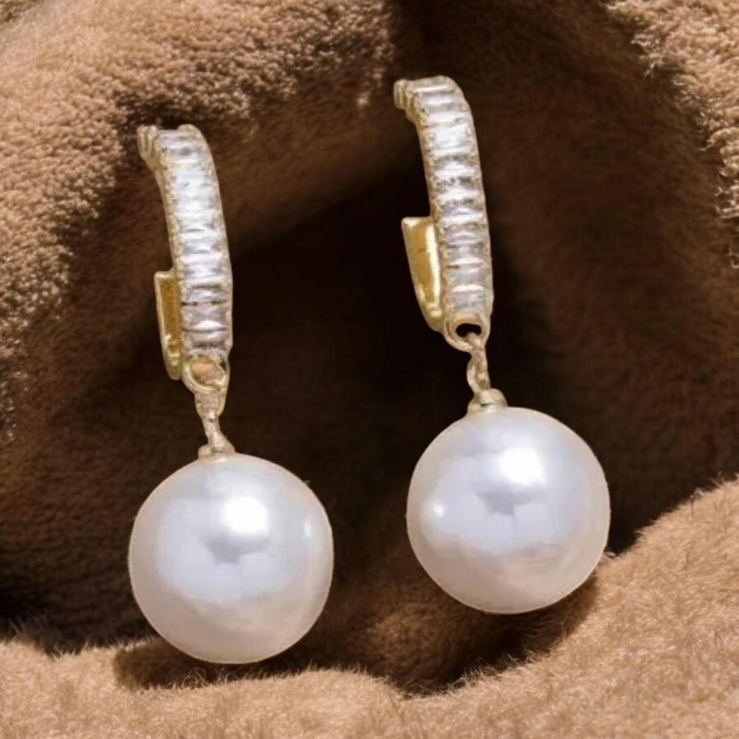 Elegant pearl and zirconia earrings from Elena - a stunning addition to any outfit