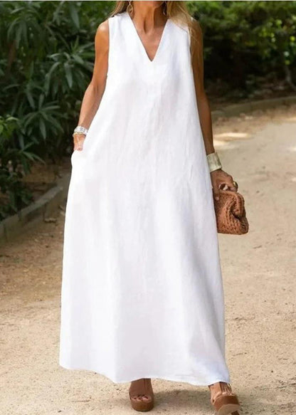 Elegant bohemian white cotton dress with V neckline and A-line hem sleeveless for a luxurious style