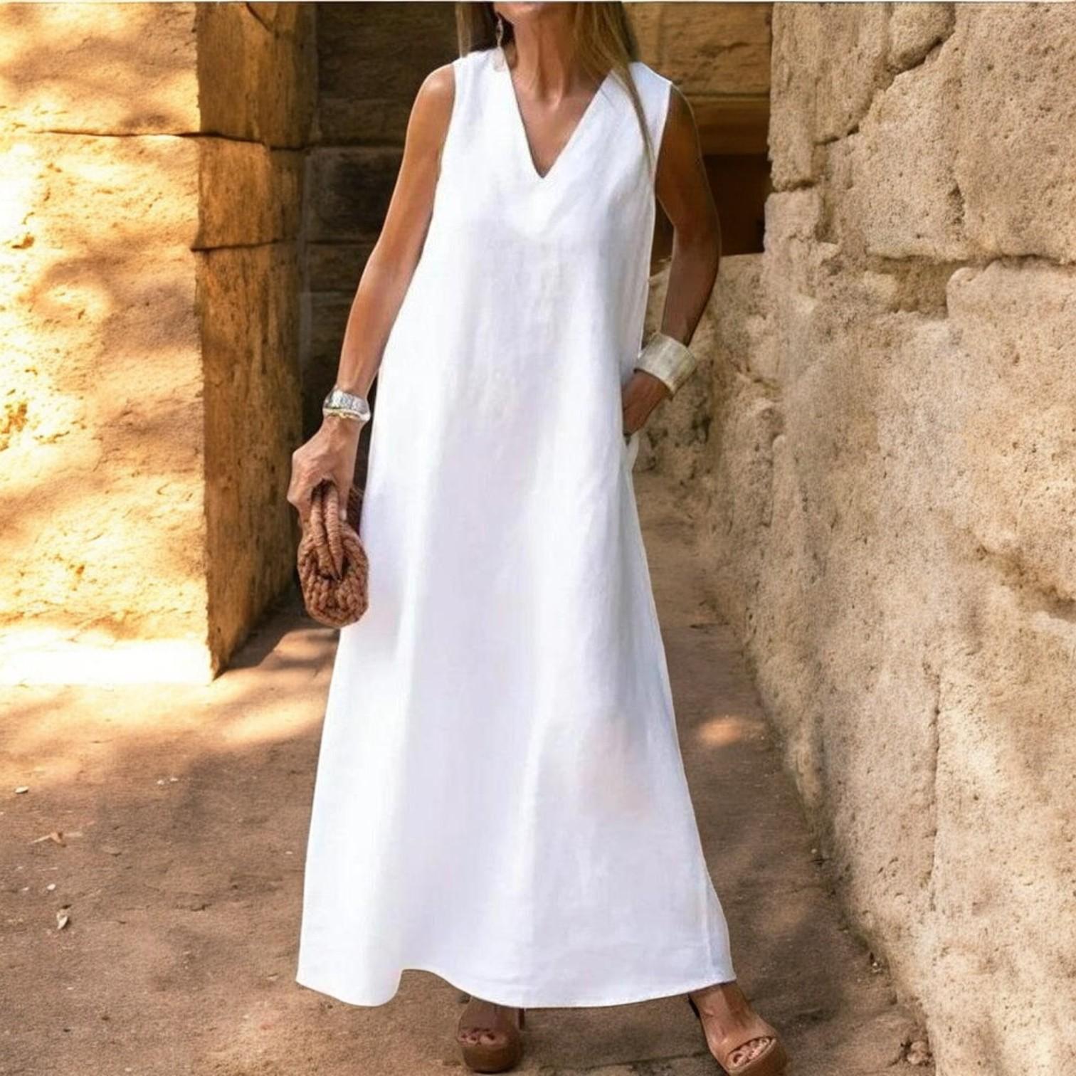 Elegant bohemian white cotton dress with V neckline and A-line hem sleeveless for a luxurious style