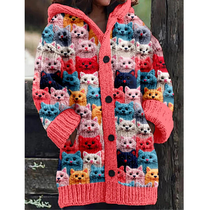 Warm knitted women's jacket with hoodie and cat pattern – stylish design, button closure, and feather insulation for a chilly day