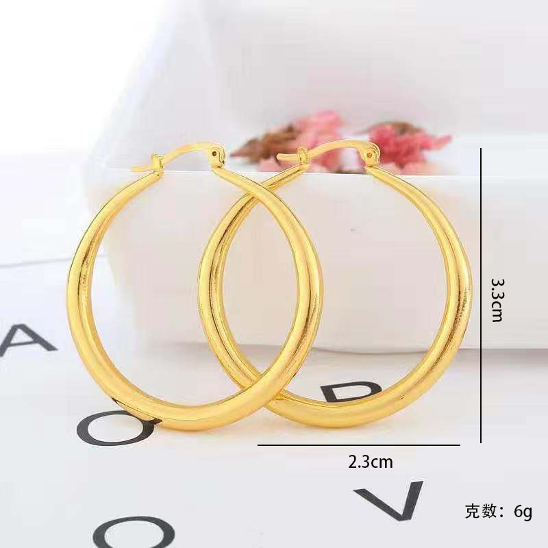Fori-Hazi - Large sparkling hoop earrings in gold color for an uncompromising style