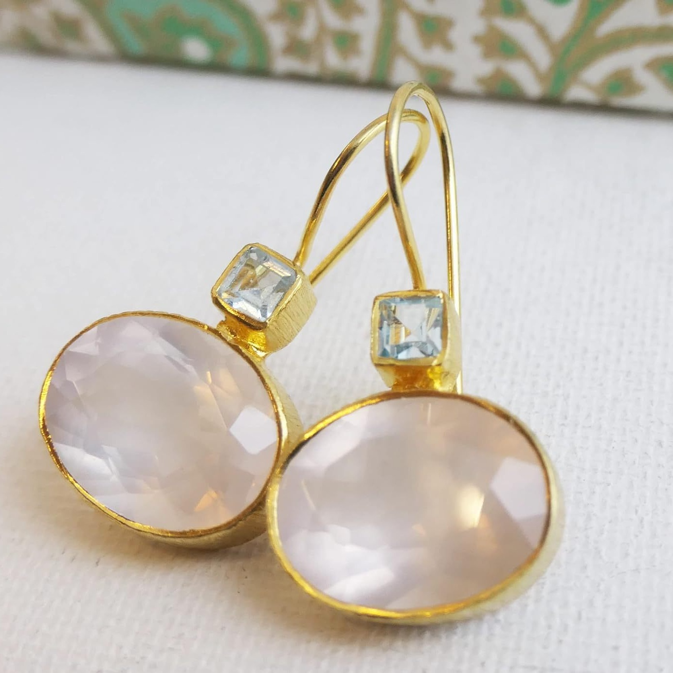 Vintage-style gold and green crystal earrings with coral pearl