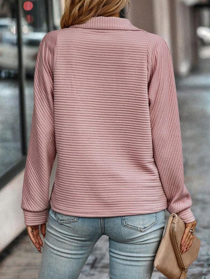 Elegant women's sweater with long sleeves and a stunning V-neckline with partial zipper for a perfect style