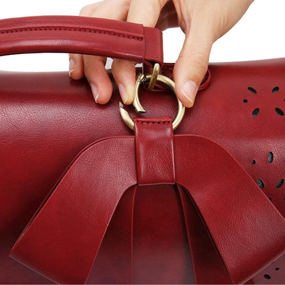 Fashionable bag with a unique and attractive feather ornament by Grace