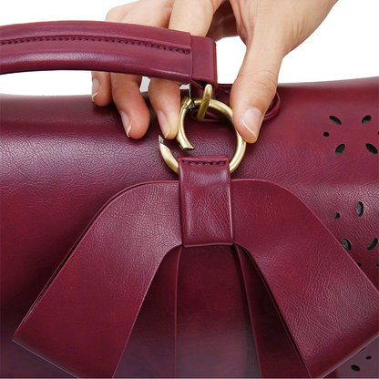 Fashionable bag with a unique and attractive feather ornament by Grace