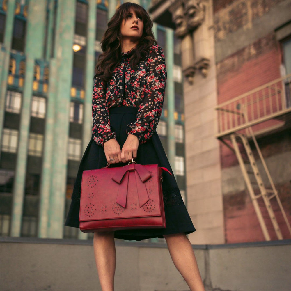 Fashionable bag with a unique and attractive feather ornament by Grace