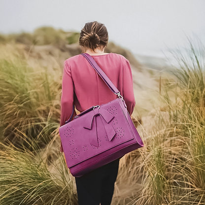 Fashionable bag with a unique and attractive feather ornament by Grace