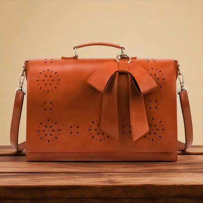 Fashionable bag with a unique and attractive feather ornament by Grace